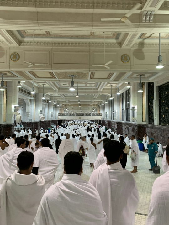 a-group-of-people-in-white-robes.jpg a group of people in white robes
